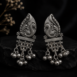 Mayurika Leaf Embossed Peacock Tribal Dangler Earrings