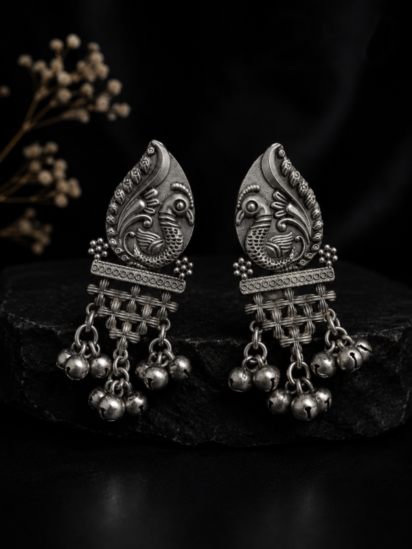 Mayurika Leaf Embossed Peacock Tribal Dangler Earrings